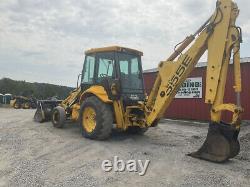 2002 New Holland 555E 2wd Tractor Loader Backhoe with Cab 4-1 Bucket Extend-A-Hoe