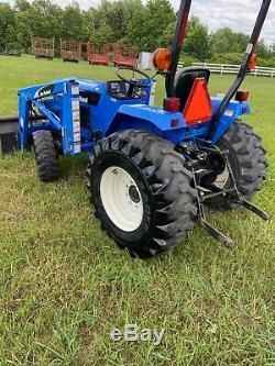 2006 New Holland TC30 4x4 hydrostatic loader tractor and new attachments