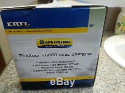 Ertl New Holland T6060 Loader Tractor 1/16 Scale. Die-Cast Metal. New in box