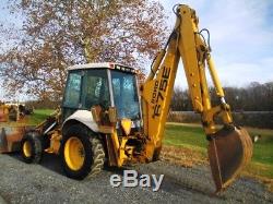 Ford New Holland 675E Tractor Loader Backhoe, 4x4, Cab, Ext Hoe, 5230 Hours