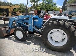 New Holland 1920 Tractor with Loader, Backhoe and 4 ft. Rotary Cutter