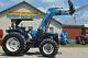 New Holland 7740 4x4 loader with hay spear and bucket