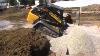 New Holland C238 Compact Track Loader Pushing Stone