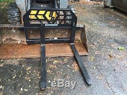 New Holland LS180 Skid steer loader with bucket and forks