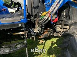 New Holland T4.105, 4 wheel drive, loader with bucket, forks, hay spear