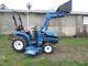 New Holland TC21d compact tractor with belly mower and loader nice one owner