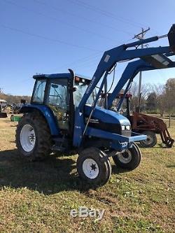 New Holland TS100 Tractor With Front Loader. Very Good Condition