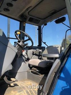New Holland TS100 Tractor With Front Loader. Very Good Condition